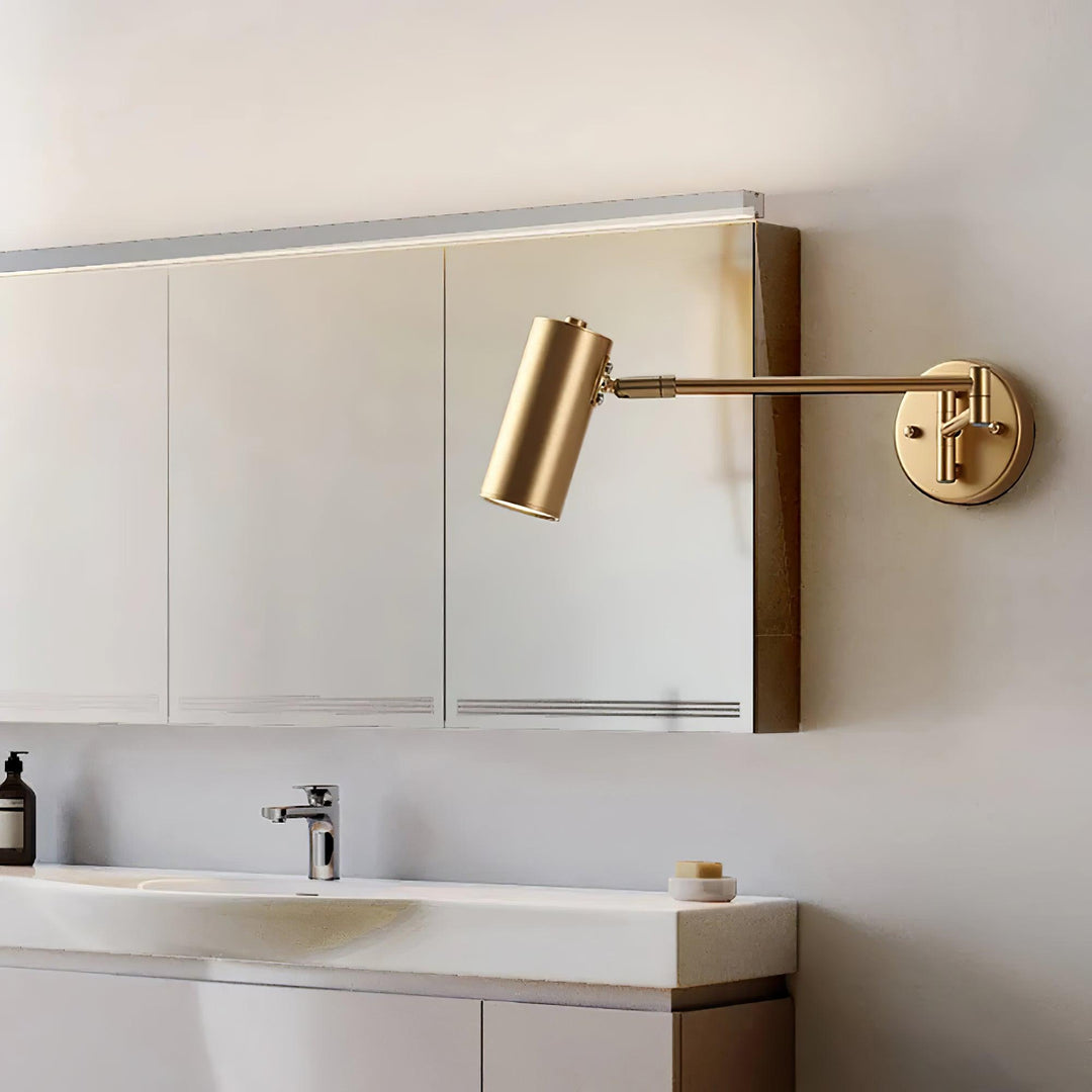 Modern Brass Swing Arm Wall Sconce Over Bathroom Vanity