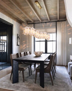 Modern Brass Hydrangea Petal Linear Chandelier in Bright Dining Room