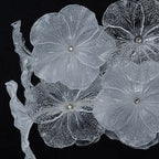 Illuminated Modern Brass Hydrangea Petal Art Glass Linear Chandelier Studio Shot on Dark Background
