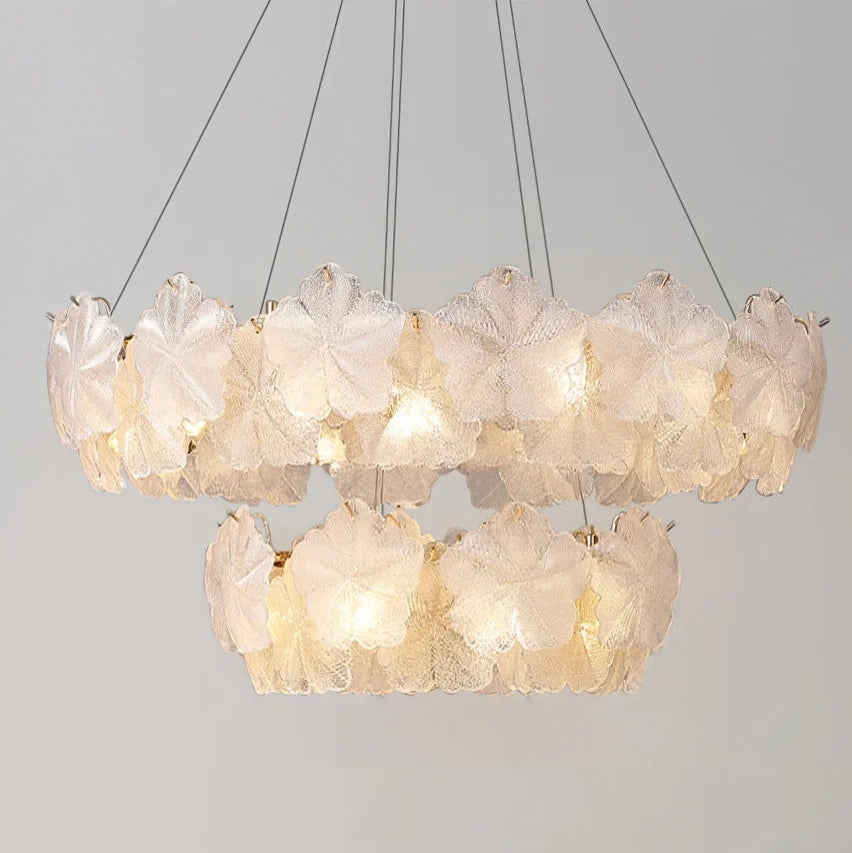 Illuminated Modern Brass White Rounded Petal Multi-Tier Chandelier Studio Display on Black Background