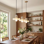 Modern Alabaster Art Glass Pendant Lights Over Dining Room Table