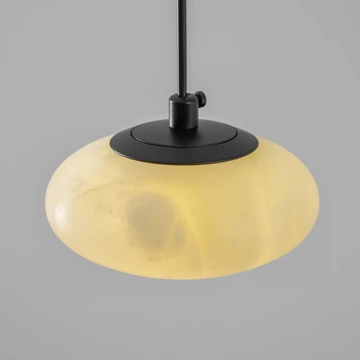Angled View of Illuminated Modern Flat Round Alabaster Pendant Light