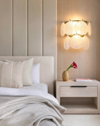 Modern Brass Shell Art Glass Wall Sconce in Master Bedroom Setting