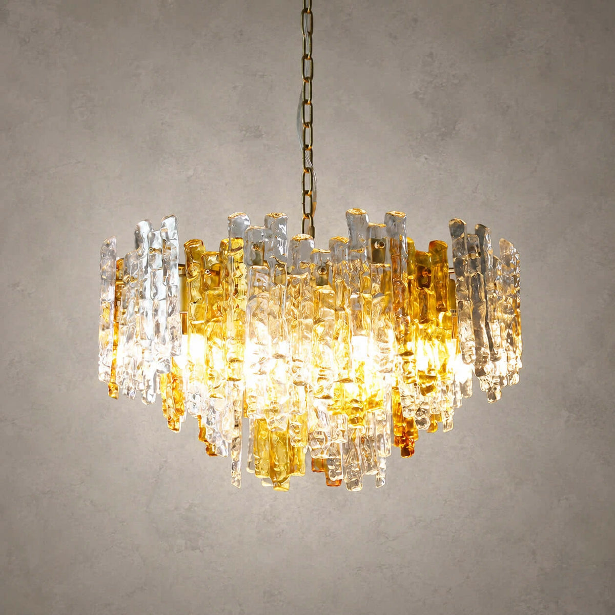 Illuminated Modern Cascading Mixed Amber and Clear Art Glass Chandelier Studio Shot