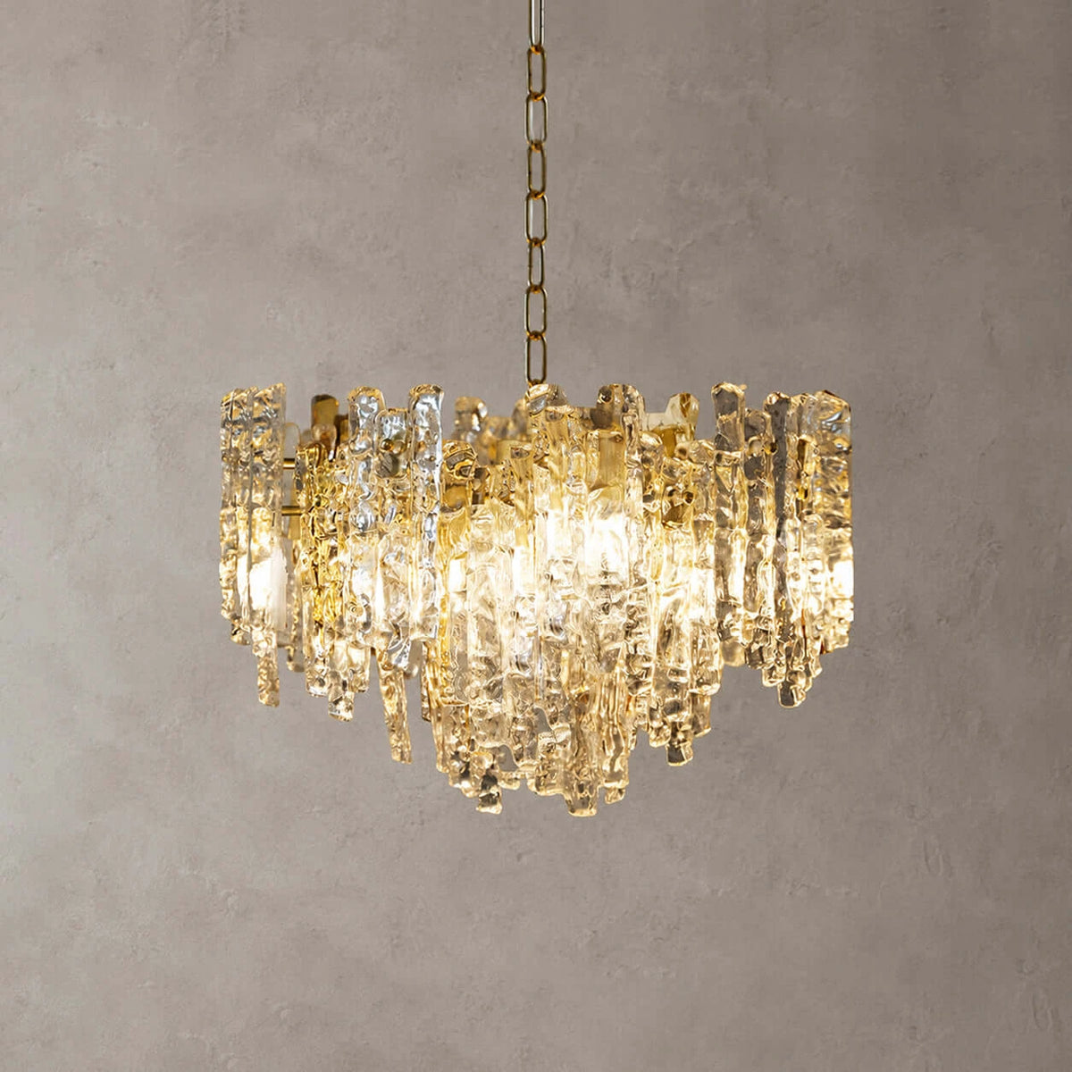 Angled View of Illuminated Modern Cascading Amber Art Glass Chandelier