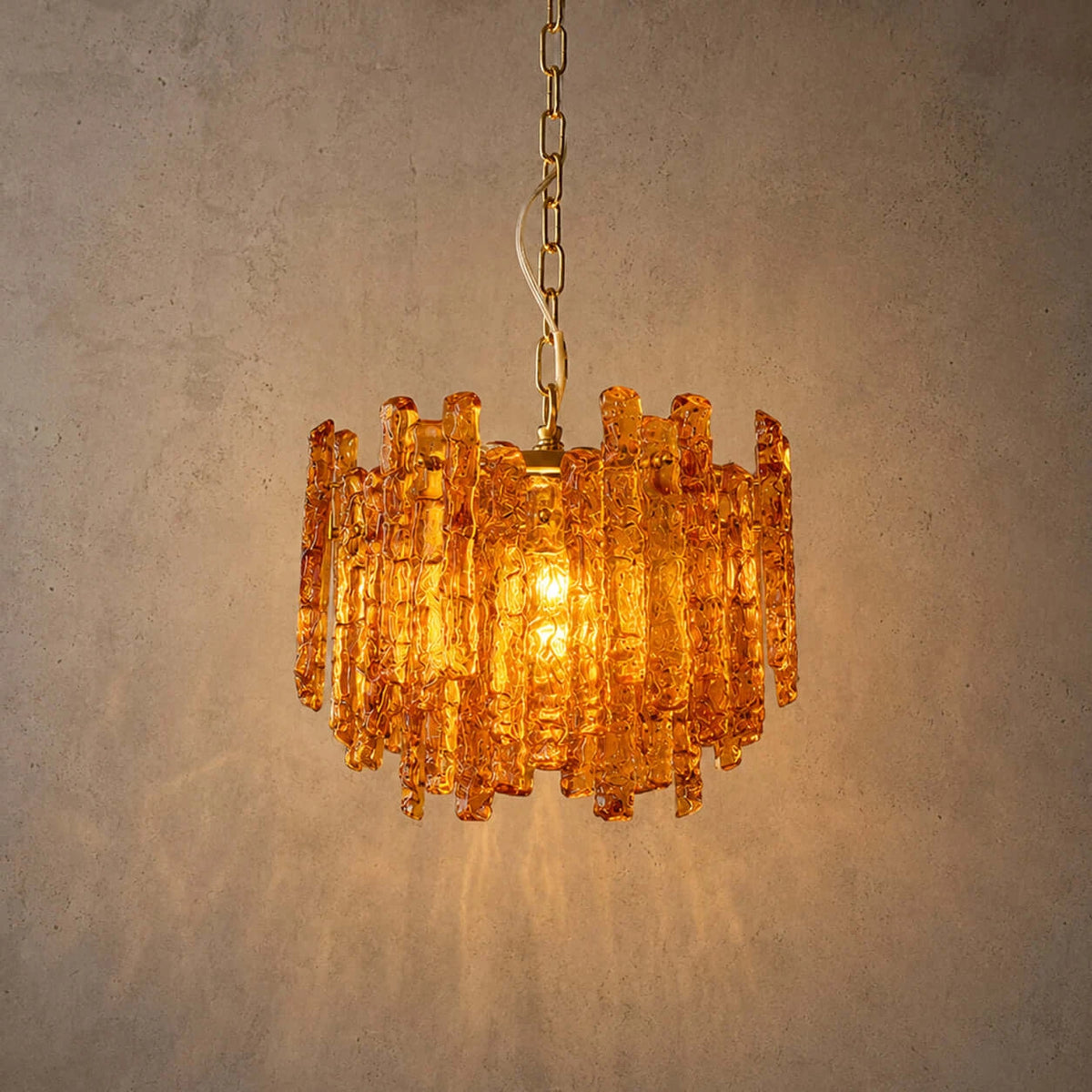 Studio Shot of Illuminated Modern Amber Art Glass Chandelier