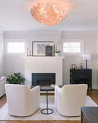 Modern Pink Crystal Floral Ceiling Light Over Fireplace Setting