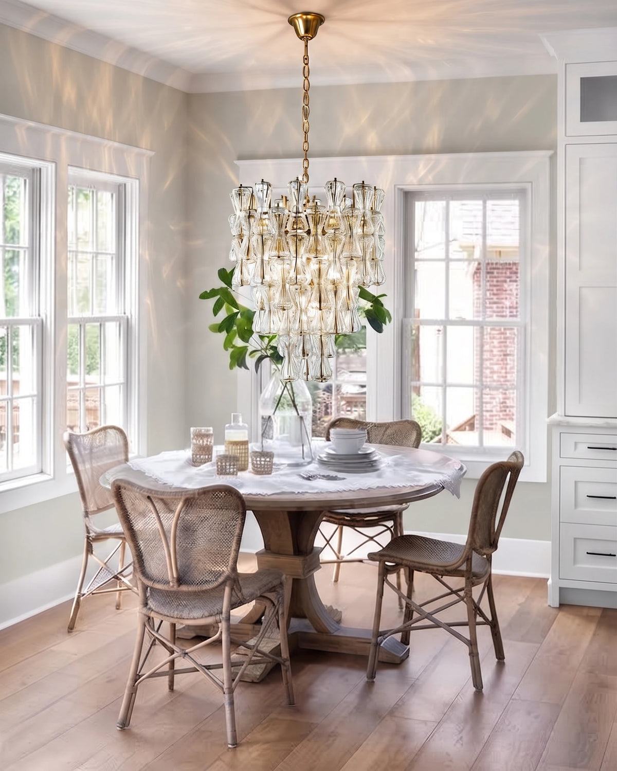 Modern Teardrop Art Glass Chandelier Over Round Dining Table
