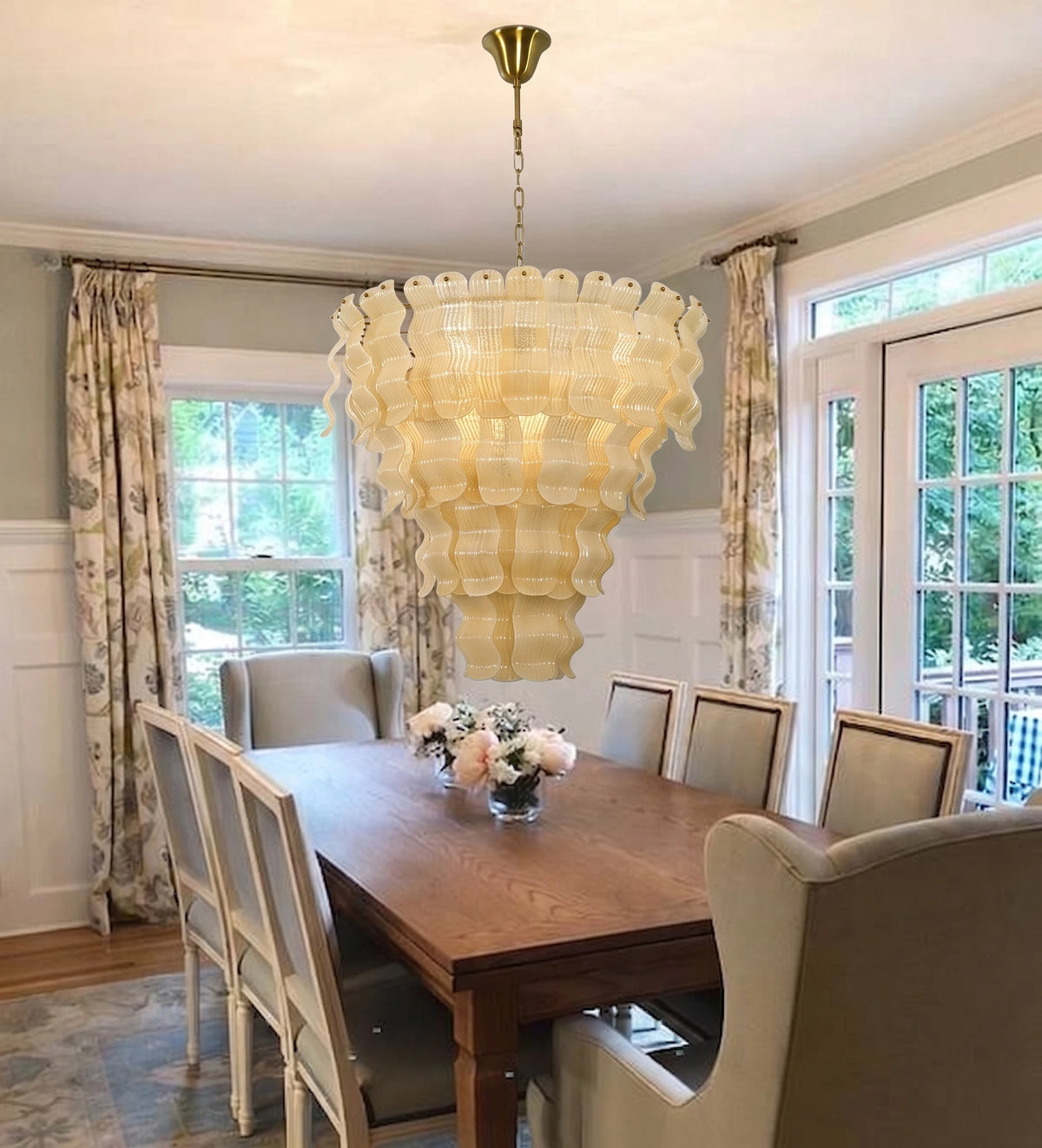 Modern Cascading Art Glass Chandelier Over Wooden Dining Room Table