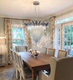 Modern Cascading Art Glass Chandelier Over Dining Room Table