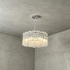 Side View of Illuminated Modern Cascading Cylindrical Glass Chandelier