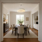 Modern Cascading Cylindrical Glass Chandelier Over Dining Room Table
