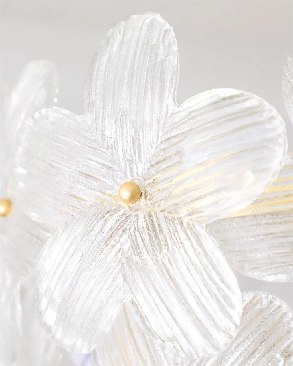 Close Up View of Faceted Crystal Flower Petals and Brass Hardware