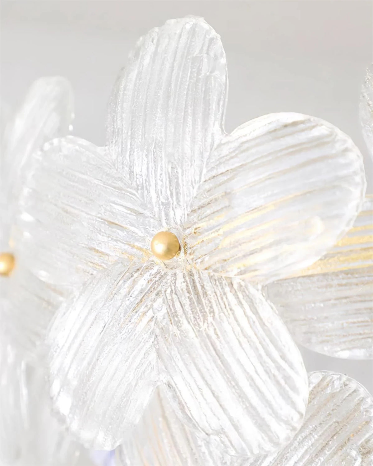 Close Up View of Faceted Crystal Flower Petals and Brass Hardware
