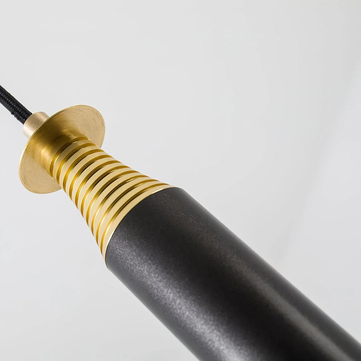 Close Up View of Brass Spiral Connector and Black Rod