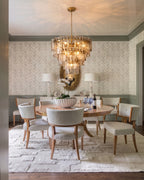 Modern Cascading Amber Faceted Glass Chandelier Over Dining Room Table