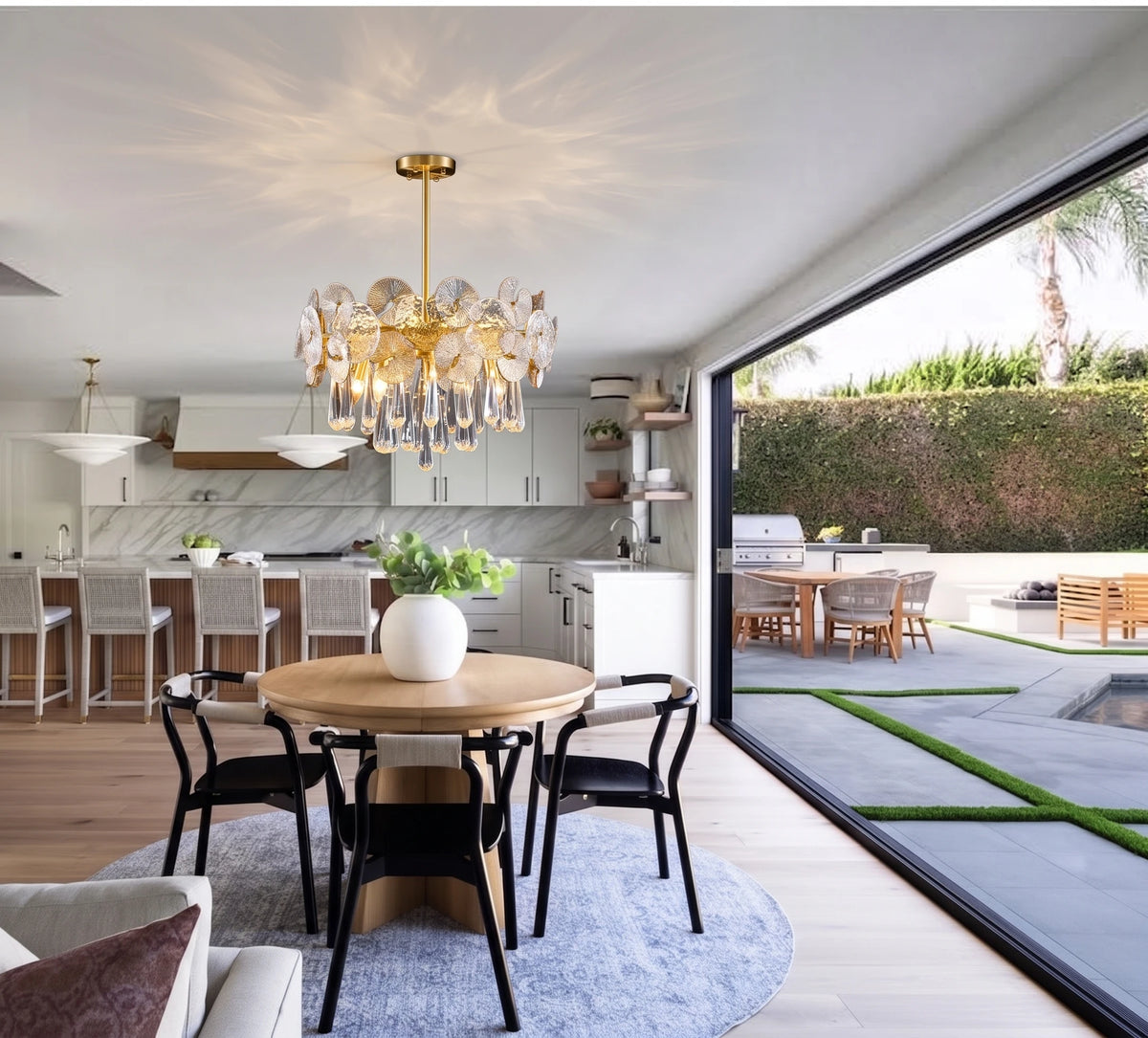 Modern Crystal Chandelier Over Dining Area with Outdoor View