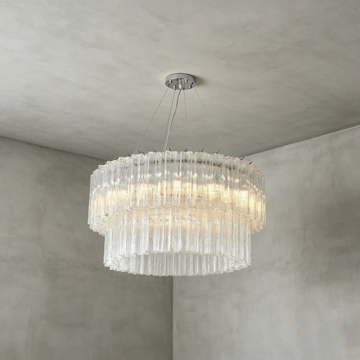 Studio Display of Illuminated Modern Cascading Cylindrical Glass Chandelier