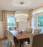 Modern Tiered Faceted Glass Chandelier Over Dining Area