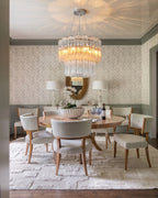 Modern Cylindrical Faceted Glass Chandelier Over Formal Dining Room Table