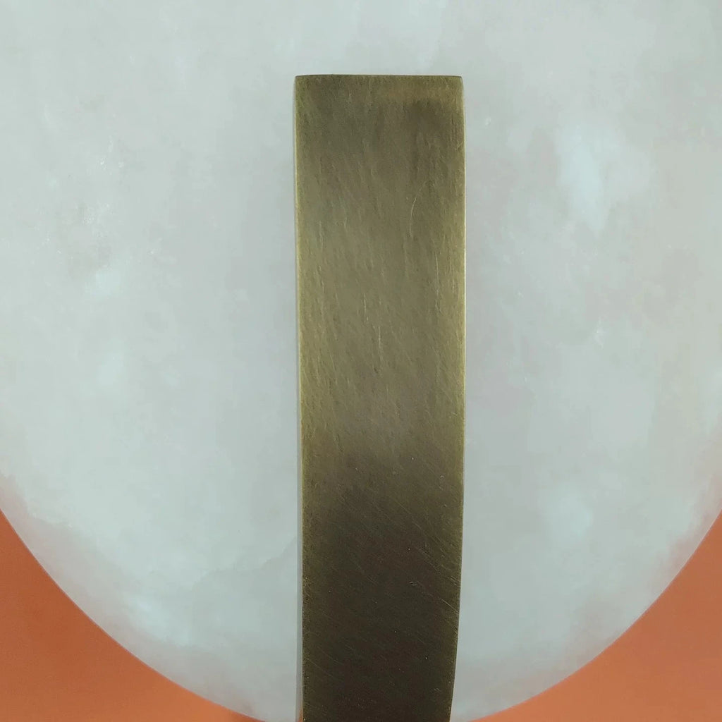 Close Up View of Brass Bracket and Oval Alabaster Stone Texture