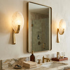Modern Oval Alabaster Wall Sconce Over Bathroom Mirror
