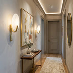 Modern Oval Alabaster Wall Sconces Along Hallway Corridor