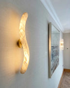 Illuminated Modern Alabaster Wall Sconce in Hallway Setting