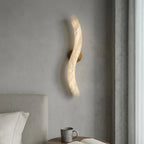 Modern S-Curved Alabaster Wall Sconce in Master Bedroom Setting