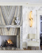 Modern S-Curved Alabaster Wall Sconce Near Fireplace Mantel