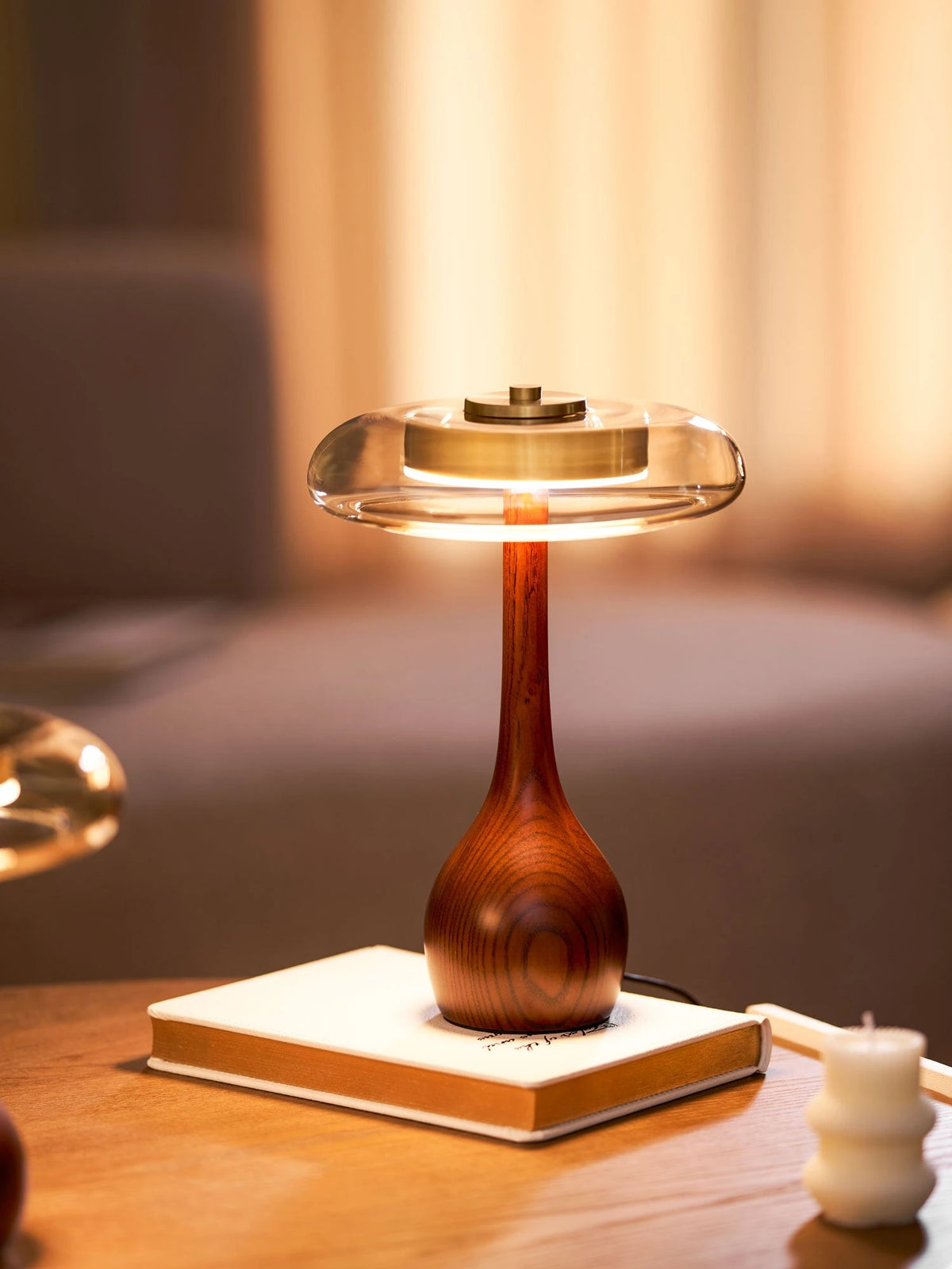 Modern Amber Glass Wood Table Lamp with Books on Table