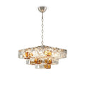 Modern Tiered Clear and Amber Art Glass Chandelier with Silver Chain on Pure White Background