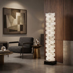 Stacked Alabaster Floor Lamp Beside Modern Living Room Armchair