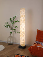 Geometric Alabaster Column Floor Lamp Over Living Room Armchair