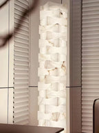 Stacked Alabaster Column Floor Lamp Beside Blinds Window