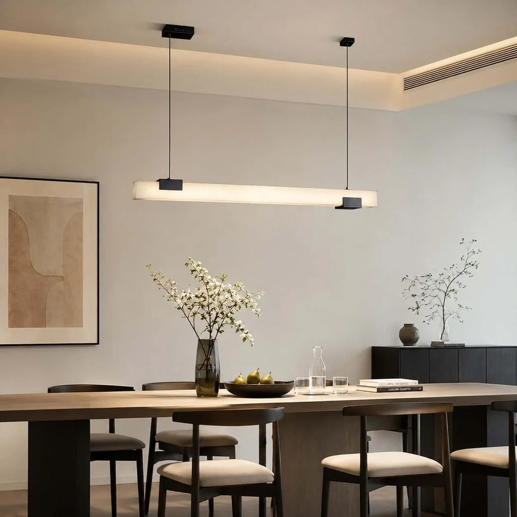 Modern Linear Alabaster Pendant Light Over Minimalist Dining Table