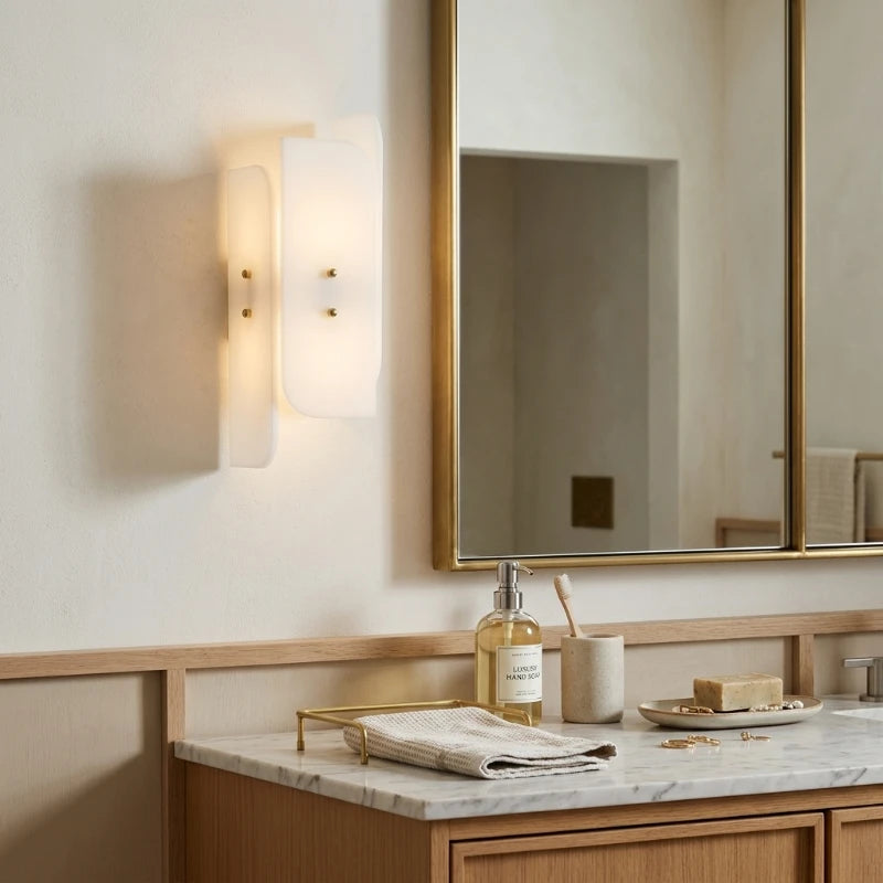 Modern Interlocking Glass Wall Sconces Over Bathroom Vanity