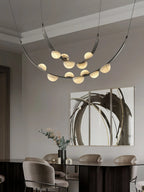 Modern Black Frame Alabaster Chandelier Over Dining Room Table