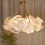 Illuminated Modern Brass Layered Wave Disc Chandelier Studio Shot