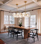 Modern Brass Layered Wave Disc Chandelier in Contemporary Dining Area
