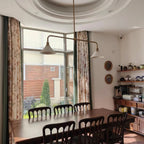 Modern Brass Double-Head Cone Glass Pendant Light in Cozy Dining Space