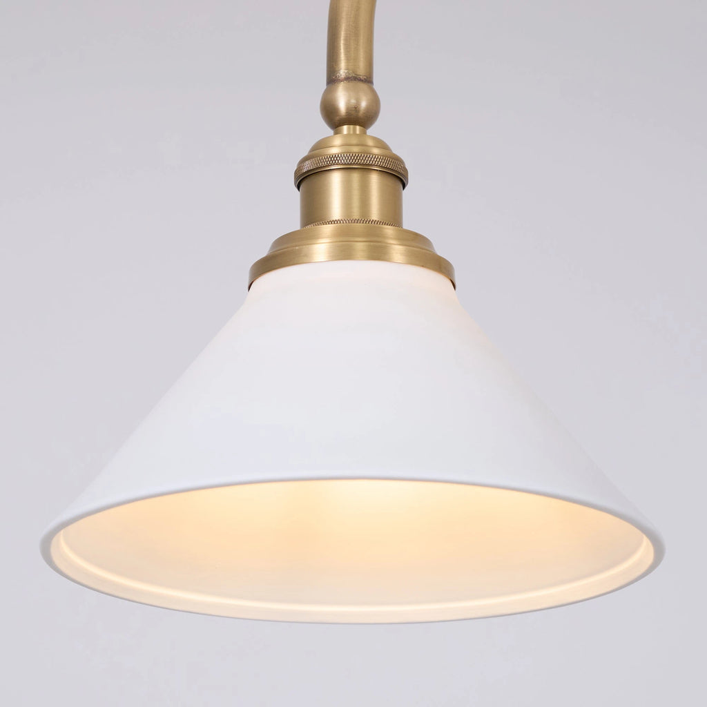 Front View of Illuminated Modern Brass Double-Head Pendant Light Studio Display