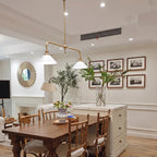 Modern Brass Double-Head Cone Glass Pendant Light in Bright Dining Setting