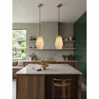 Modern Faceted Alabaster Pendant Light Over Wood Kitchen Island