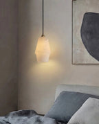 Illuminated Modern Alabaster Pendant Light Over Bedroom Nightstand