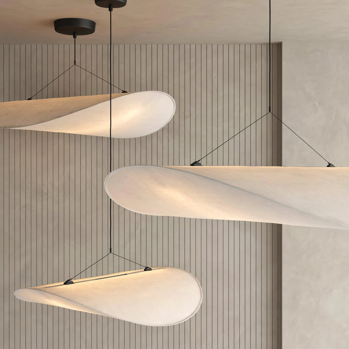 Modern Black Frame Cloud Wave Art Pendant Lights Against Wooden Slatted Wall