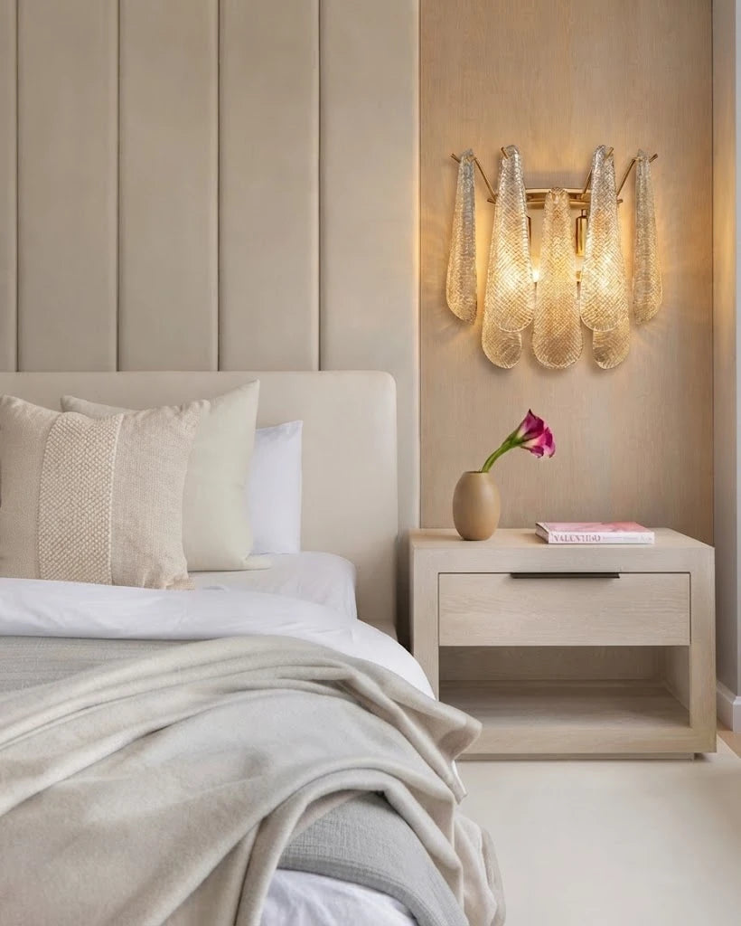 Modern Brass and Ice Glass Wall Sconce in Cozy Bedroom