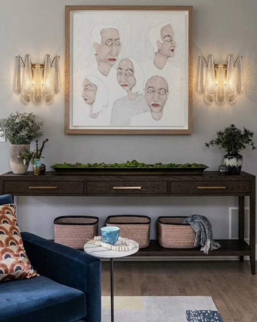 Modern Brass Wall Sconces Over Credenza and Artwork
