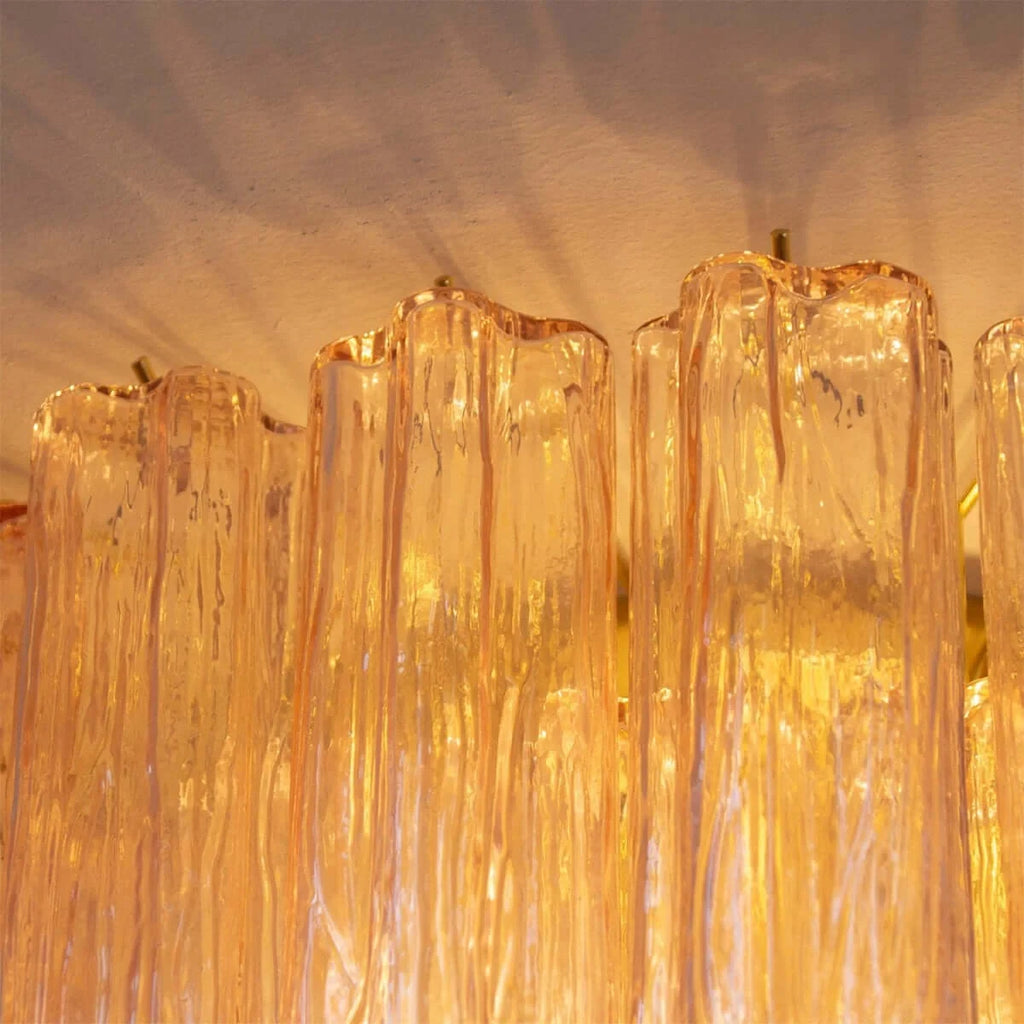 Close Up View of Illuminated Amber Crystal Prism Ceiling Light Texture
