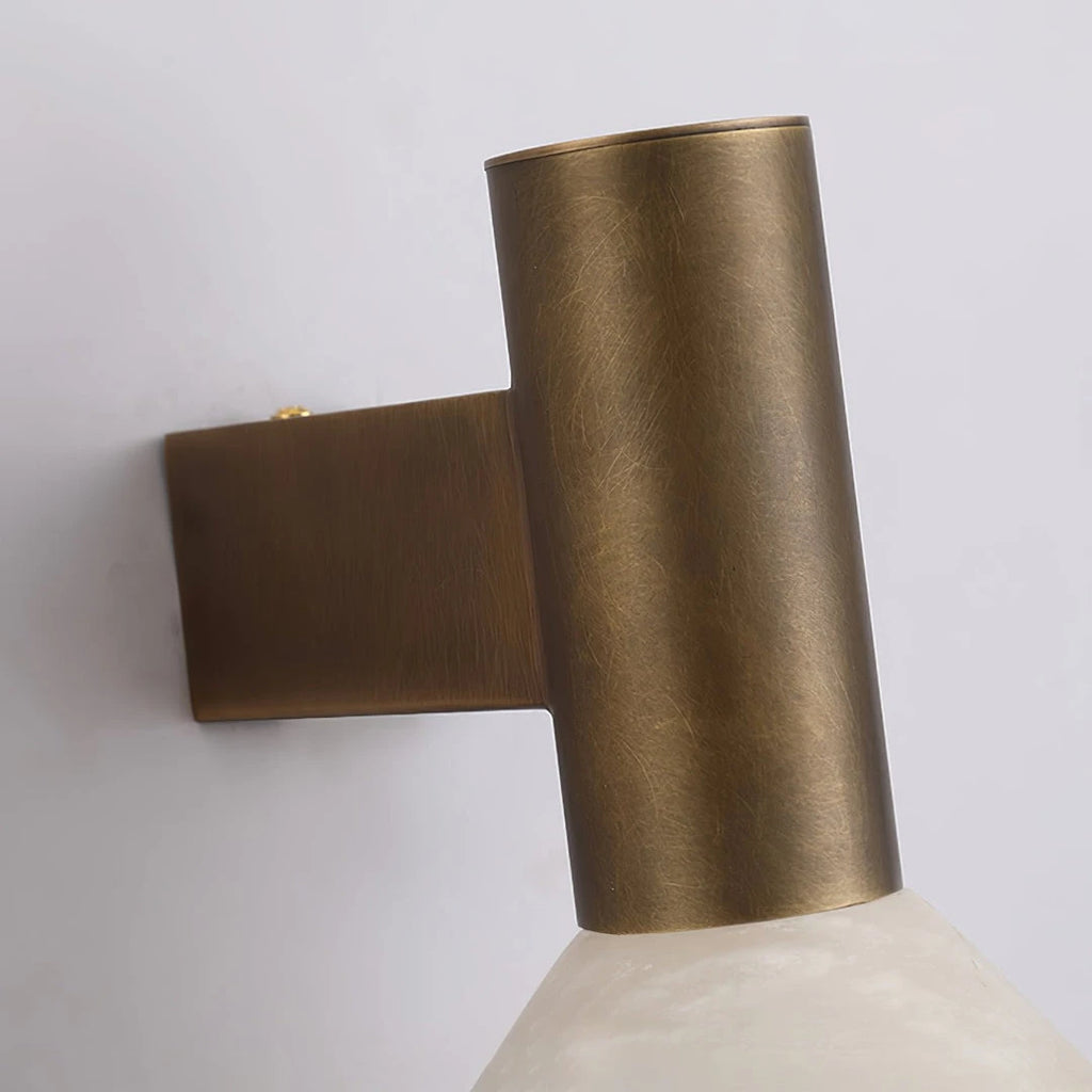 Close Up View of Brass Cylinder Fixture and Marble Shade Connection